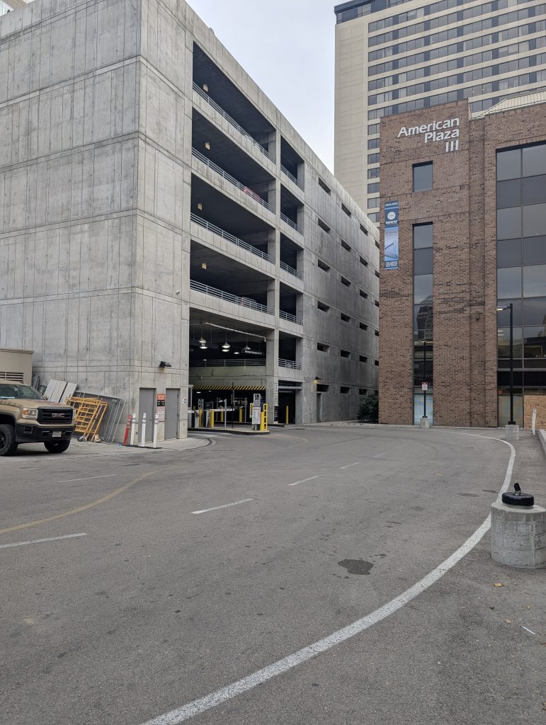This photos is immediately beyond the Kimpton Hotel Monaco Salt Lake City, 15 W 200 S, Salt Lake City, UT 84101. The parking garage is the gray structure on the left of the photo.